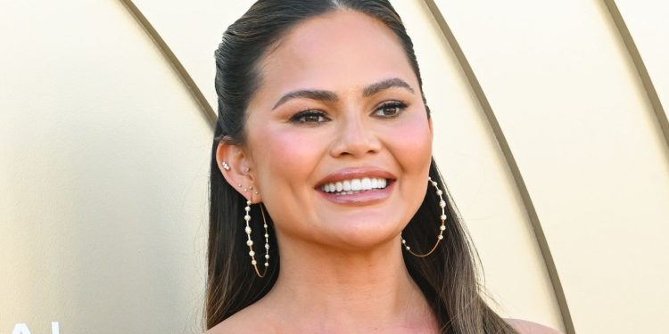 Chrissy Teigen Lost a Veneer, But She’s Still Smiling — See Photos
