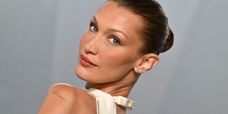 Bella Hadid’s Tousled Bombshell Updo Is So ’90s Pamela Anderson—See the Photos