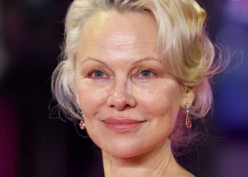Pamela Anderson’s Feathery Layers Are a Trip to the ’70s—See the Photos