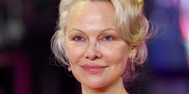 Pamela Anderson’s Feathery Layers Are a Trip to the ’70s—See the Photos