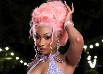 Megan Thee Stallion’s Cotton Candy Curls Just Entered the Villa—See the Photos